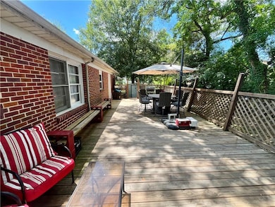 Wooden deck featuring outdoor dining space