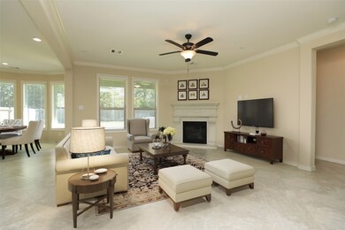 Spacious living area with tile flooring, fireplace with views of the backyard. This room has been virtually staged.