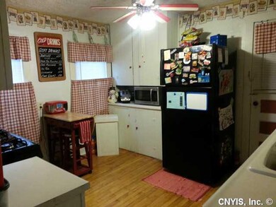 Kitchen. Large kitchen features gleaming hardwood 