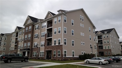 View of apartment building / complex with uncovere