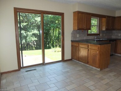 Nice dinette with slider to back patio.
