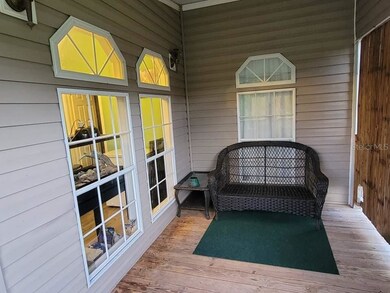 L shaped deck on back left of house 1