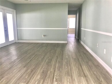 Family Room leading to lanai overlooking the pool