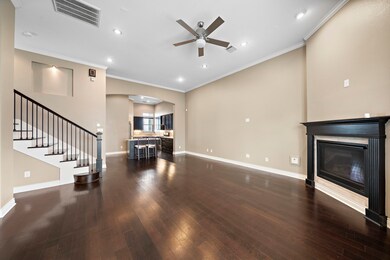 Open concept living area features soaring ceiling,