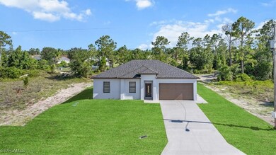 View of front facade featuring an attached garage,