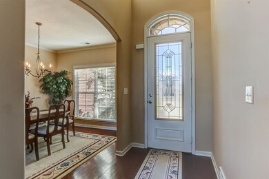 Light and Bright Entry Hall with Cut Glass Wood Front Door. There is Harwood  in the Entry Hall, Dining Room, Great Room & Kitchen Breakfast area. Move in ready, well Maintain and Updated One Owner Home.