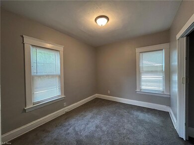 Carpeted empty room with a healthy amount of sunlight