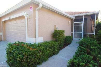 View of home's exterior with a garage and a sunroo