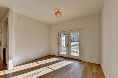 Entryway featuring hardwood / wood-style floors and french doors