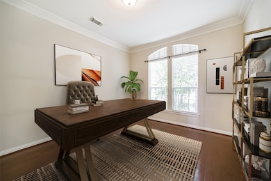On the right side of the foyer french doors open t