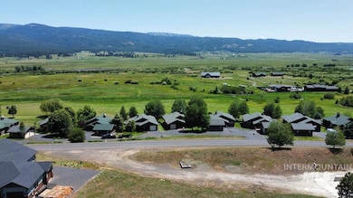 Overview of rural landscape featuring a mountain backdrop and nearby suburban area