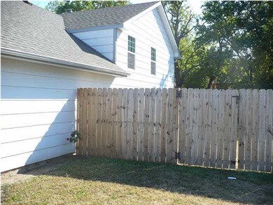 NORTH SIDE OF HOME WITH NEW FENCING