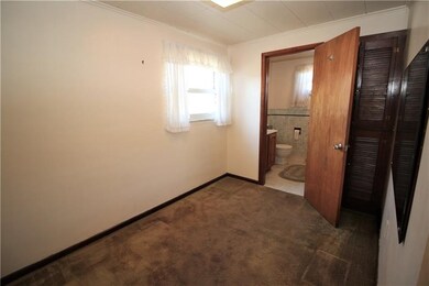 The first floor den has a deep linen closet and a 