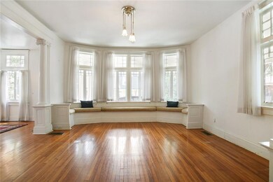 Gorgeous hardwood floors and curved window seat.