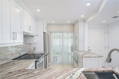 Gorgeous stone countertops and backsplash, NEW sta