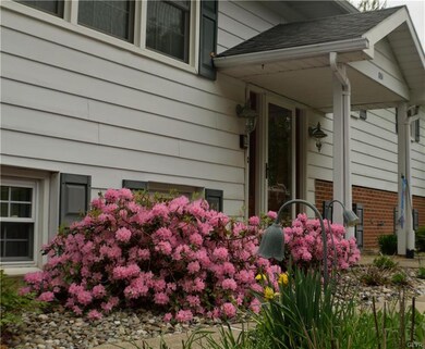 Pretty flowers invite you inside.