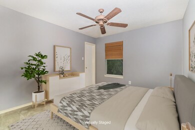 staged Bedroom featuring light carpet and ceiling 