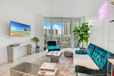 Comfy living room space, high ceilings and balcony at end facing city views
