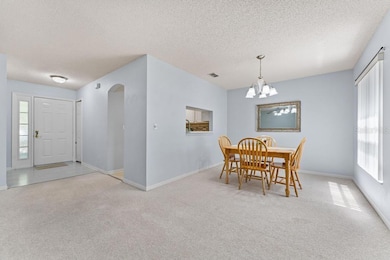 Dining room with serving hatch from kitchen.