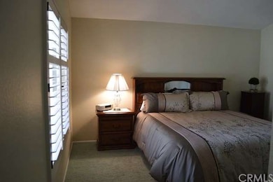 Master bedroom with plantation shutters and volume
