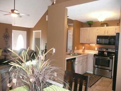 VIEW OF LIVING  AND KITCHEN FROM DINING AREA
