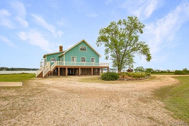 Rear view of house with a near 360 degree deck