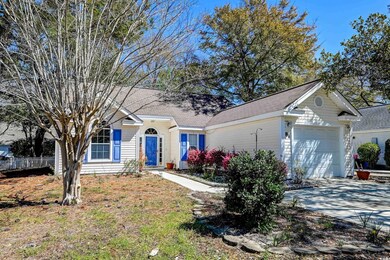 Ranch-style home with concrete driveway, a garage,