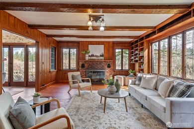 View of living room from front door. Fir Floors.