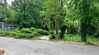 View of asphalt road with a wooded view