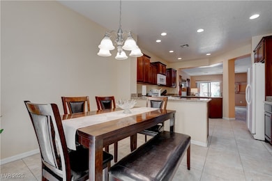 Dining room with visible vents, baseboards, recess