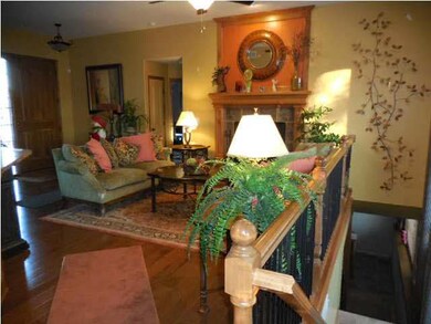 MAPLE CABINETRY WOOD SURROUNDS THE FIREPLACE IN TH