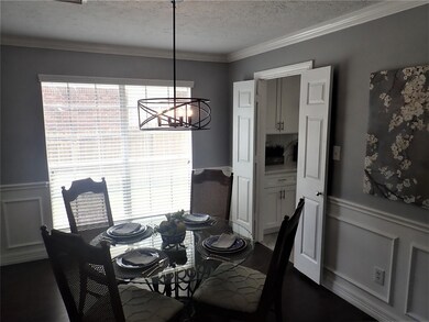 Wainscoting, crown molding and laminate wood floor