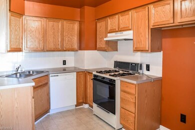 Kitchen comes applianced with a dishwasher, oven a