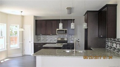 Large kitchen with granite counter tops, kitchen i