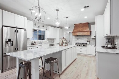 Prepare meals in the stunning kitchen featuring a 