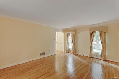Second view of living room with door to foyer.