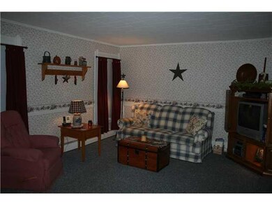 Living Room. A solid wall in the livingroom is a n