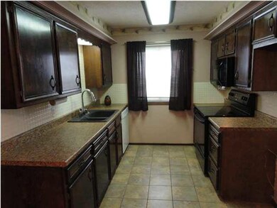 Updated kitchen has new tile, dishwasher, and oven