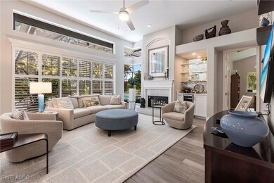 Living room featuring a ceiling fan, wood finished