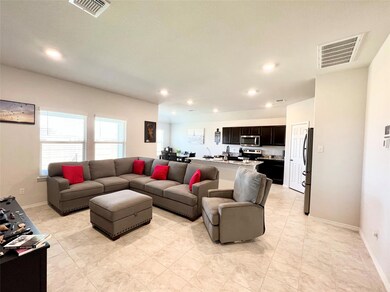 Living area featuring recessed lighting and baseboards
