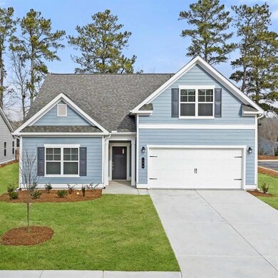 View of front of property with a garage and a fron