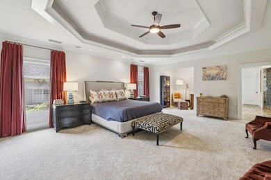 Upstairs, the Oversized Primary Suite offers a Serene Escape with Room for a Sitting Area, a Built-In Wet Bar for your morning coffee, and Two Massive Walk-In Closets