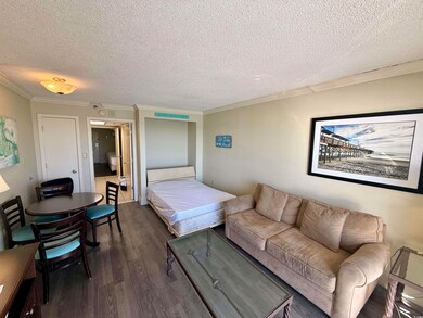 Bedroom featuring a textured ceiling, crown moldin