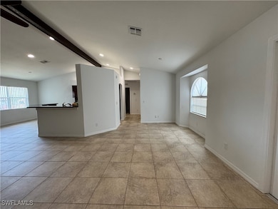 Unfurnished room with a healthy amount of sunlight