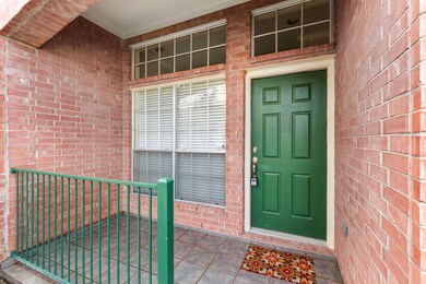 A nice, covered front porch and entry door with la