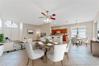 KITCHEN overlooks LIVING ROOM and DINING AREA. Vir