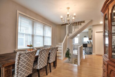 Spacious Dining Room exhibits trio windows, glamor