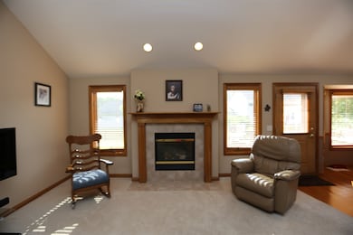 Tile surrounds Fireplace with accent lighting brig