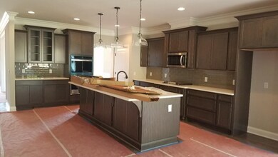Incredible kitchen with so MANY cabinets.  Pull-out spice rack, utensil rack, trash/recycling. Sand and finish hardwoods throughout main-level common areas.