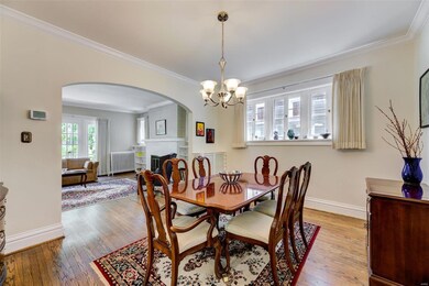 The dining room with a view into the living room.